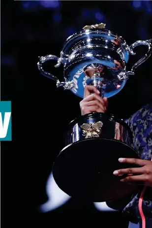  ??  ?? Naomi Osaka shows off the Daphne Akhurst Memorial Cup after beating