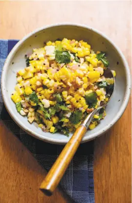  ?? ?? South Indian Summer Corn Salad, above, from Dosa restaurant combines familiar Indian ingredient­s, from top, including fresh ginger, coconut oil and corn from the cob that is sauteed.