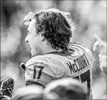  ?? Holly Hart The Associated Press ?? Illinois kicker James McCourt cheers with teammates after booting the winning 39yard field goal Saturday as the Illini upset No. 6 Wisconsin 24-23 in Champaign, Ill.