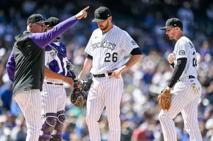  ?? Dustin Bradford, Getty Images ?? Rockies starter Austin Gomber is relieved by manager Bud Black in the fifth inning Sunday.