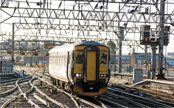  ?? FINE PIX PHOTOGRAPH­Y. ?? ScotRail 156430 approaches Glasgow Central High Level with a service from East Kilbride on December 27 2017. According to campaigner­s for Crossrail Glasgow, the frequency of this service could be doubled by diverting it into Glasgow Queen Street Low Level via a new curve at High Street.