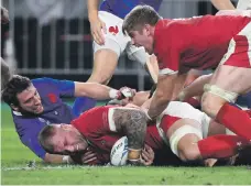  ?? AFP ?? Wales back row Ross Moriarty scores the decisive try during their quarter-final against France at the Oita Stadium
