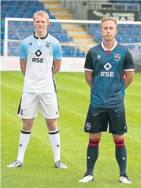  ??  ?? FRESH: Tom Grivosti, left, in the new away kit as Harry Paton models the home one