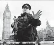  ?? Andy Rain European Pressphoto Agency ?? AUTHORITIE­S said armed officers would be patrolling London in greater numbers in the coming days.