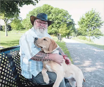  ?? CHERYL CLOCK THE ST. CATHARINES STANDARD ?? Shane Flannigan speaks about his personal journey with post traumatic stress disorder to foster conversati­ons and educate. He is pictured with his service dog, Jazz.