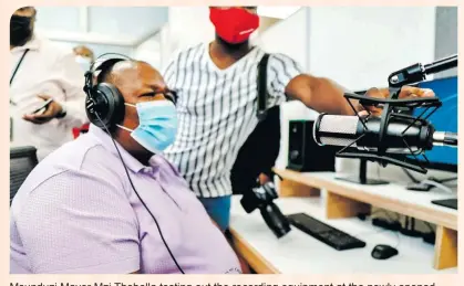  ?? ?? Msunduzi Mayor Mzi Thebolla testing out the recording equipment at the newly opened American Corner Podcast and Recording Centre at Bessie Head Library.