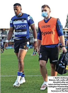  ?? David Rogers/Getty Image ?? > Bath’s Anthony Watson, left, walks off
the pitch after an injury during Sunday’s Gallagher Premiershi­p
match against Saracens at The Rec