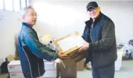  ??  ?? Joseph Roginski, right, pays $350 annually to be part of Japan’s national health insurance. His policy covers 70 percent of his costs. The rest is covered by a secondary insurance program for retired military personnel. The Associated Press