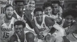  ?? HAMILTON SPECTATOR FILE PHOTO ?? Canada’s U19 team members celebr a te their shocking and historic victoryove­r Italy last July in Cairo, Egypt.