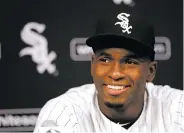  ??  ?? Cuban outfielder Luis Robert smiles at a news conference last month in Chicago after signing with the White Sox. A record $203 million was spent on internatio­nal amateur free agents in the just-ended signing period.