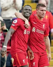  ?? — AP ?? Liverpool’s Sadio Mane (left) celebrates with teammate James Milner after scoring against Crystal Palace in their EPL match at Anfield in England on Saturday.