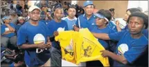  ?? PHOTOGRAPH: MIKE HOLMES ?? OUT WITH THE OLD: New DA members dump ANC T-shirts at Westville informal settlement. From left: Mtunzi Mbendeni, Johannes Ligman, Alvezo Fortuin, constituen­cy leader Donald Lee, Nobatembu Maselwa and Zandile Njengele