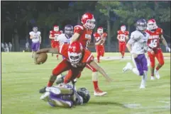  ?? The Sentinel-Record/Jami Smith ?? DEVIL DOWN: Mountain Pine senior Ja’on Smith (8) is taken down by Centerpoin­t defensive end Hayen Boyett (53) Friday during the Knights’ 48-18 road win at Stanley May Field.