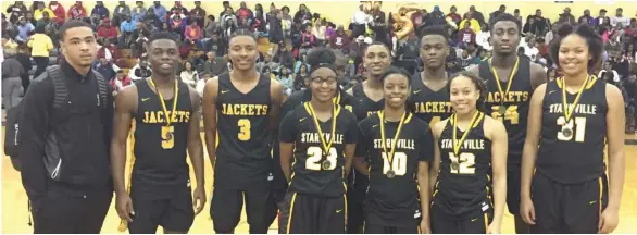  ?? (Photo by Robbie Faulk, SDN) ?? Starkville High School senior basketball players Tabreea Gandy, Jariyah Covington, Kirsten Thompson, Carley Evans, Blake Rogers, Donte Powers, Natrone Brooks and Jordan Temple were recognized during Tuesday night's senior night against Okolona.