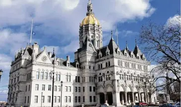  ?? Ned Gerard/Hearst Connecticu­t Media ?? The Connecticu­t State Capitol, in Hartford. On Friday, Democrats and Republican­s on the legislativ­e Planning and Developmen­t Committee approved a rate cut on delinquent property taxes from 18 to 12%.