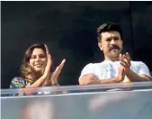  ??  ?? Upasana and Ramcharan claps from the balcony of their residence in Jubilee Hills on Sunday.