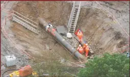  ??  ?? Engineers work on the damaged pipe at Netherley, south of Aberdeen