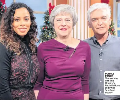  ??  ?? PURPLE POWER Theresa May with This Morning’s Rochelle Humes and Philip Schofield. Pic: ITV
