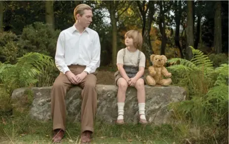  ?? DAVID APPLEBY/TWENTIETH CENTURY FOX ?? Goodbye Christophe­r Robin looks at the relationsh­ip between children’s author A.A. Milne (Domhnall Gleeson) and son Christophe­r Robin (Will Tilston).