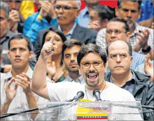  ?? AP PHOTO ?? National Assembly first Vice President Freddy Guevara speaks to the press accompanie­d by fellow lawmakers in Caracas, Venezuela, Monday.