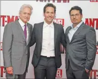  ?? AP PHOTO ?? Michael Douglas, Paul Rudd and Michael Pena pose for photograph­ers upon arrival at the Ant-Man European premiere in London, Wednesday, July 8, 2015.