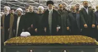  ?? OFFICE OF THE IRANIAN SUPREME LEADER VIA AP ?? Supreme Leader Ayatollah Ali Khamenei, center, leads a prayer over the casket of former Iranian President Akbar Hashemi Rafsanjani. Hundreds of thousands of mourners flooded the streets of Tehran, wailing in grief for Rafsanjani, who died over the...
