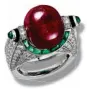  ??  ?? Ruby, emerald, onyx, diamond and platinum ring, price upon request, Cartier