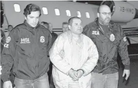  ?? ASSOCIATED PRESS ?? Federal authoritie­s escort Joaquin "El Chapo" Guzman from a plane to a waiting caravan of SUVs at Long Island’s MacArthur Airport in 2017.