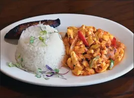  ?? PHOTOS BY SHERRY LAVARS — MARIN INDEPENDEN­T JOURNAL ?? Caribbean Spices' Ackee and Saltfish comes with onions, cherry tomatoes, sweet plantains and rice.