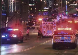  ?? WISN 12 NEWS VIA AP ?? This photo taken from video shows police responding to the scene of a shooting at Water Street and Juneau Avenue in Milwaukee on Friday.