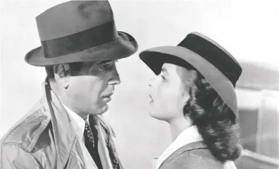  ?? WARNER BROS. ?? A kiss is still a kiss: Love is found and lost in the Academy Award-winning 1942 wartime classic Casablanca, starring Humphrey Bogart, left, and Ingrid Bergman.