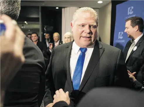  ?? CHRIS YOUNG / THE CANADIAN PRESS ?? Doug Ford leaves a press conference after being named leader of the Ontario Progressiv­e Conservati­ves on Saturday.