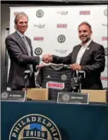  ?? SUBMITTED PHOTO ?? Union owner Jay Sugarman, left, shakes hands with new sporting director Ernst Tanner at Tanner’s introducto­ry press conference Thursday at Talen Energy Stadium.