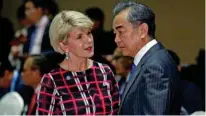  ?? - Reuters ?? MEETING: Australia’s Foreign Minister Julie Bishop with China’s Foreign Minister Wang Yi during the 8th East Asia Summit Foreign Ministers’ Meeting in Singapore August 4, 2018.