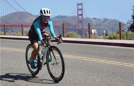  ?? Contribute­d photo ?? ALCATRAZ ESCAPEE. Baguio pride Lou Ann Ramos bikes her way around San Francisco’s ‘The Escape from Alcatraz Triathlon’ on June 3 and became the second Filipina to finish in one of the most toughest triathlon event in the world.