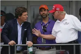  ?? SETH WENIG — THE ASSOCIATED PRESS FILE ?? Former President Donald Trump, right, talks with Donald Trump Jr., center, and Tucker Carlson at the 16th tee during the final round of the Bedminster Invitation­al LIV Golf tournament in Bedminster, N.J., on July 31.