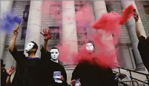  ?? Spencer Platt / Getty Images ?? Climate activists, including members of Extinction Rebellion, participat­e in a demonstrat­ion in front of the Thurgood Marshall US Courthouse against a recent Supreme Court ruling on June 30, in New York City.