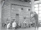  ?? LIZ DUFOUR/ USA TODAY NETWORK ?? At the National Undergroun­d Railroad Freedom Center in Cincinnati in 2011, students learn about a slave pen moved from Mason County, Ky.