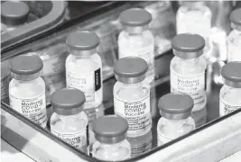  ?? VEEJAY VILLAFRANC­A Bloomberg | Dec. 28, 2021 ?? The findings build on previous reports about the effectiven­ess of updated boosters from Moderna and Pfizer, which showed the shots sharply reduced risks of severe COVID in older adults, but didn’t assess how long protection lasted.