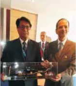  ??  ?? Dr RK Tyagi, Chairman HAL presenting model of HAL LCH to Minister of Civil Aviation Mr Ajit Singh during the Paris Air Show, 2013