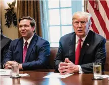  ?? Jabin Botsford/The Washington Post ?? Ron DeSantis, then-Florida governor-elect, listens as then-President Donald Trump speaks during a meeting with governors-elect at the White House in 2018.