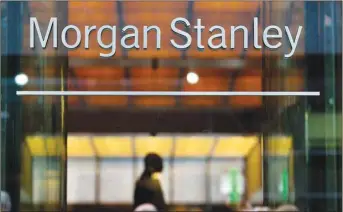  ??  ?? Morgan Stanley signage is displayed outside of the company’s headquarte­rs in New York. Like fellow Wall Street trading powerhouse Goldman Sachs, Morgan Stanley capitalise­d on a flurry of activity in financial markets as clients bought and sold stocks in response to the coronaviru­s pandemic and many companies went public or raised fresh capital.