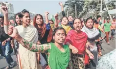  ??  ?? Bangladesh­i striking garments workers march in the streets of Dhaka during a third day of demonstrat­ion to demand wage hikes. Bangladesh’s 4,500 textile and clothing factories exported more than US$30 billion worth of apparel last year, making clothing for retailers such as H&amp;M, Walmart, Tesco, Carrefour and Aldi. — AFP photo