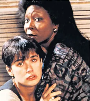  ??  ?? Girls in danger: Whoopi Goldberg as Oda Mae Brown and Demi Moore as Molly in Ghost