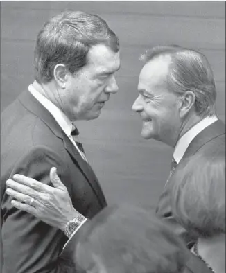  ?? Brian van der Brug Los Angeles Times ?? USC’S NEW ATHLETIC DIRECTOR, Mike Bohn, left, chats with Rick Caruso, chairman of USC’s Board of Trustees, following Bohn’s introducto­ry news conference.