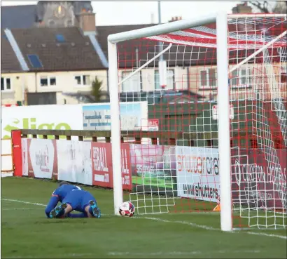  ??  ?? Alan Mannus lets Walter Figueira’s shot go under him to give Sligo Rovers the lead against Shamrock Rovers. Pics: Carl Brennan.