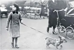  ?? ?? Lead role: Princess Elizabeth exercising one of her corgis in Hyde Park, London, in 1936