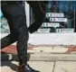  ?? ?? A man walks past an Italianthe­med gift shop in the 3400 block of North Harlem Avenue on April 19.