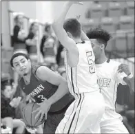  ?? NWA Democrat-Gazette/ANDY SHUPE ?? Conway guard Carson Petrucelli (left) tries to find an open teammate while being pressured by Fayettevil­le defenders Quinn Schach (center) and Jon Coley during the first round of the Class 7A boys state basketball tournament Wednesday at Van Buren. The...