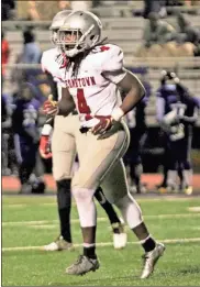  ??  ?? Tony Mathis trots of the field toward the sidelines after a long night running on the field for the Cedartown Bulldogs.